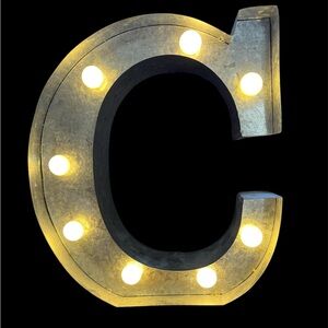 Metal letter C lighted sign.